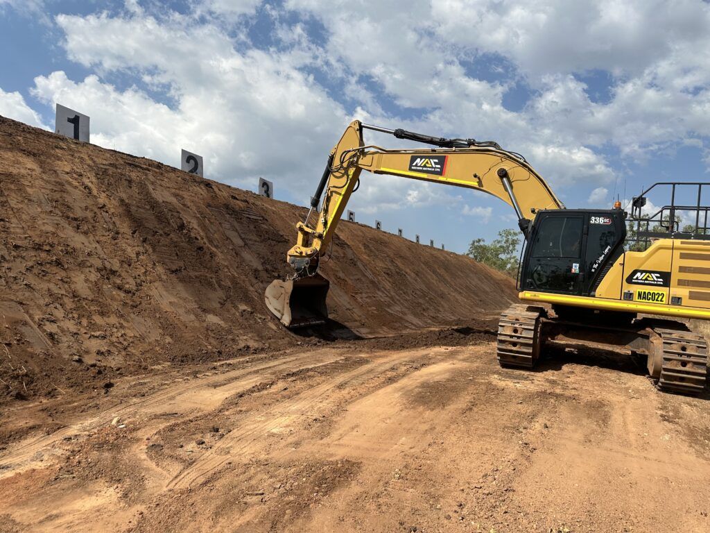 Excavator battering a cut
